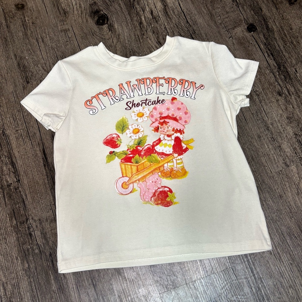 Strawberry Shortcake Graphic Tee - Cream Base Women’s Baby Tee Size M